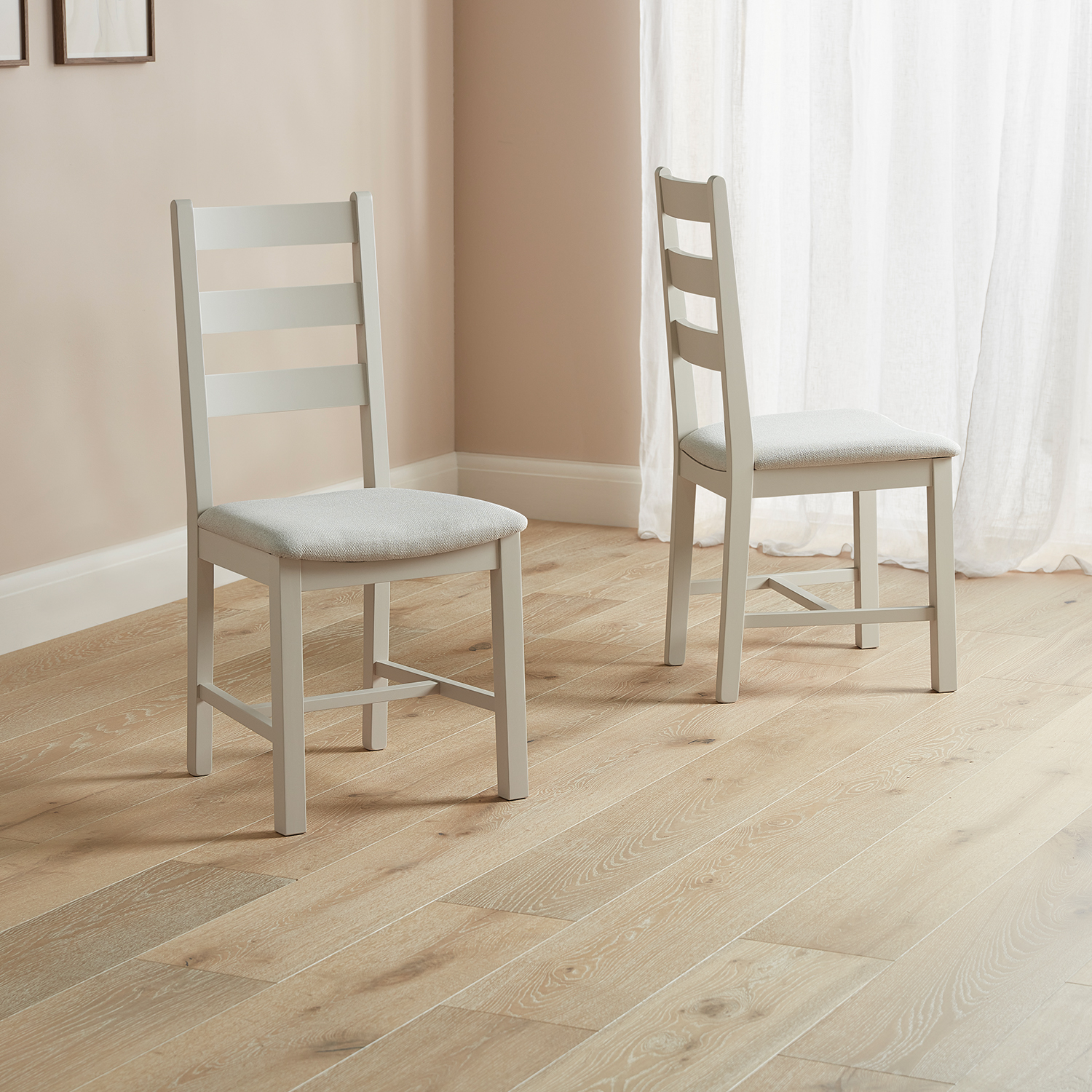 Modern Farmhouse dining chair ladder back style with fabric seats placed on a wooden floor