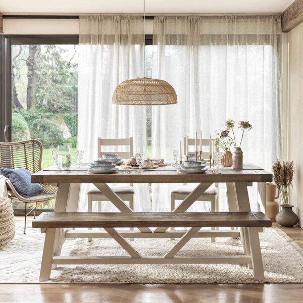 Reclaimed pine 2m extendable dining table with two chairs and bench in sun lit room