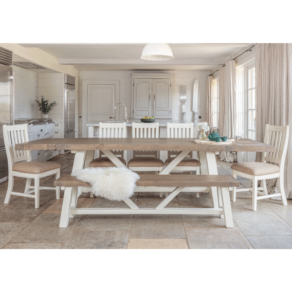 modern farmhouse dining table 2m with both sides extended surrounded by 5 x chairs and bench in the foreground- in white rustic kitchen setting