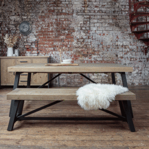 Urban extendable dining table- 2m. infront of an exposed brick wall