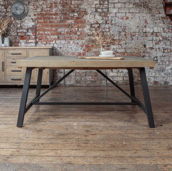 Urban 1.6m table infront of exposed brick wall