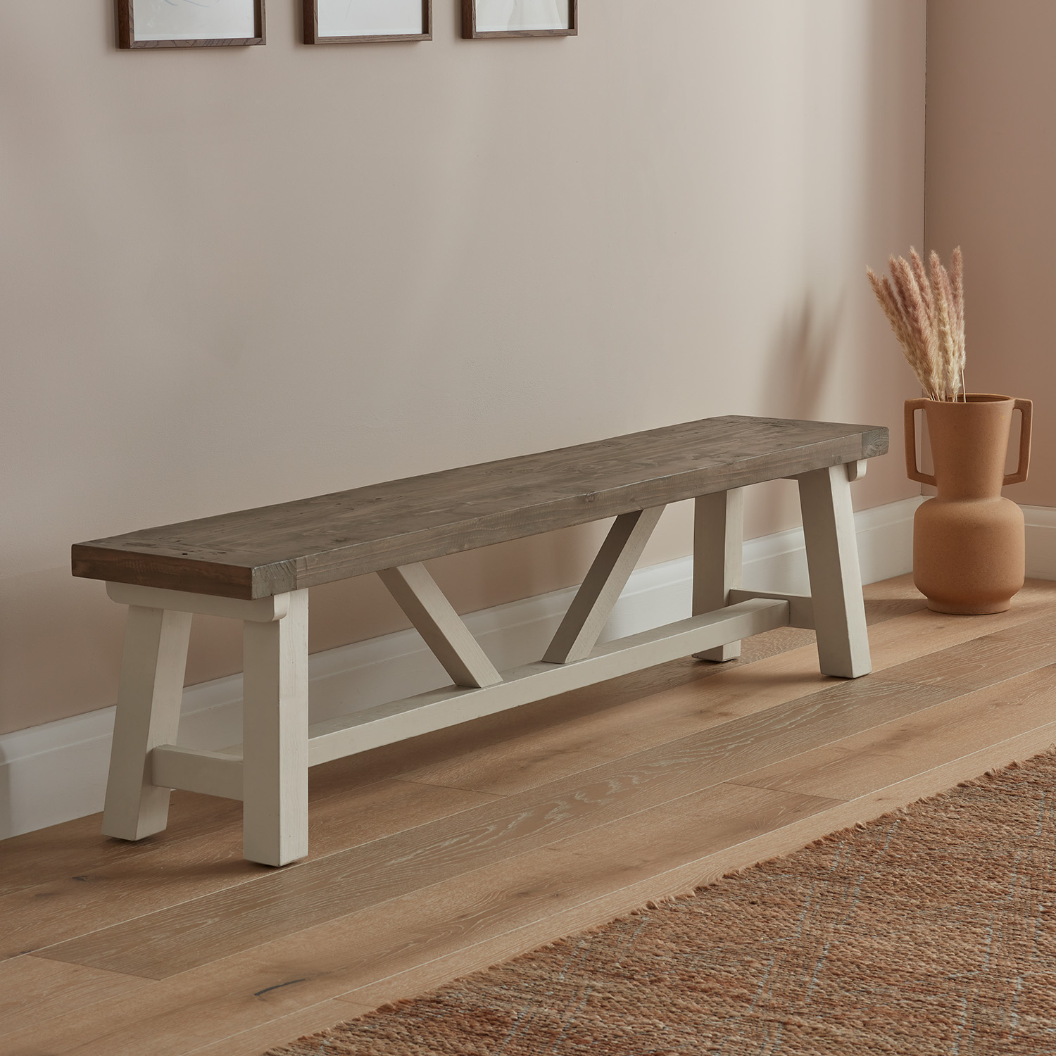 Modern Farmhouse Bench in large size with brown chunky wood top placed on wood flooring in hallway alongside ornate vase