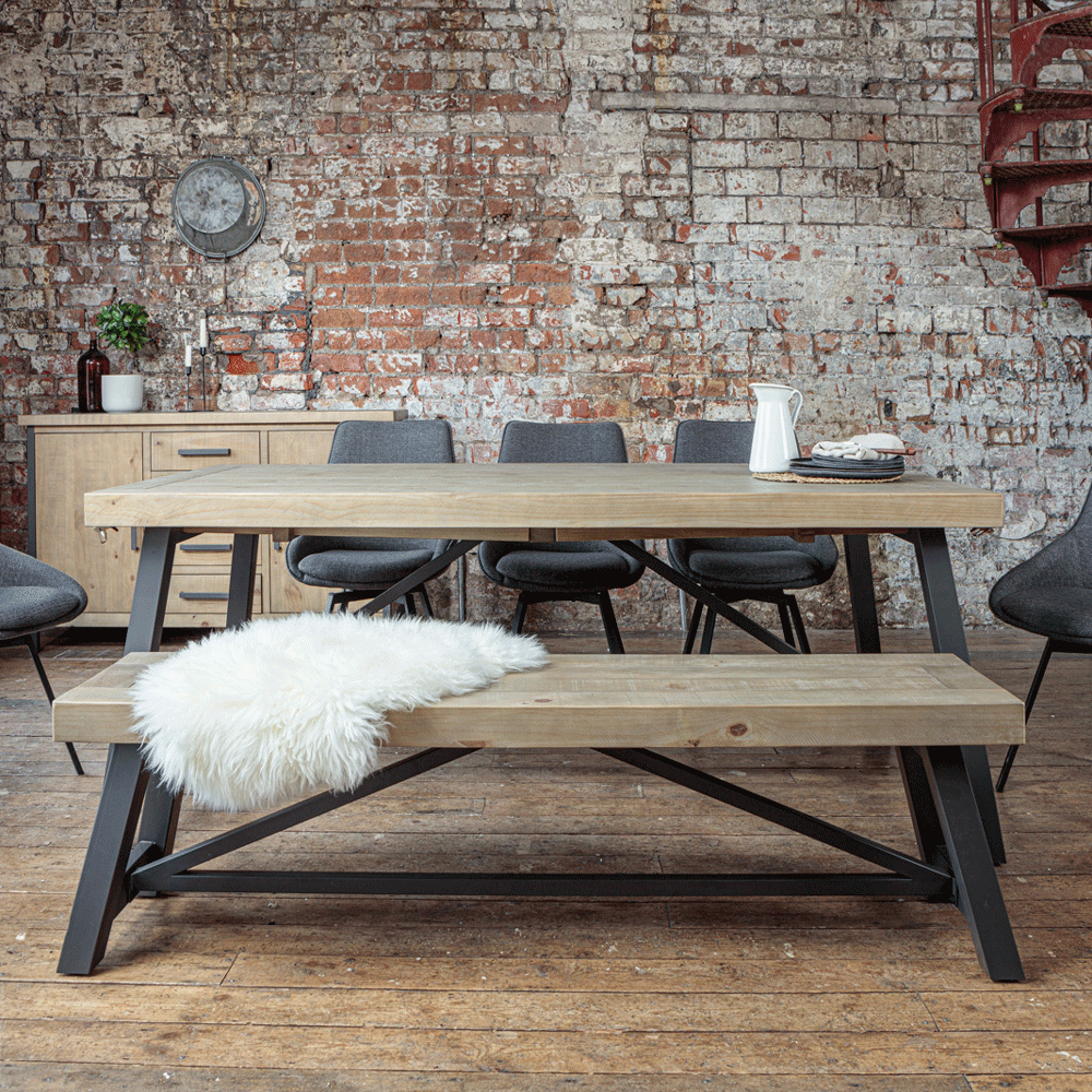 Urban dining bench and table with fluffy throw placed on bench