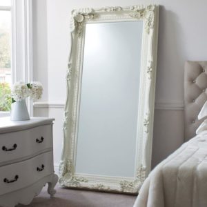Chateau Leaner Mirror in Cream in a bedroom
