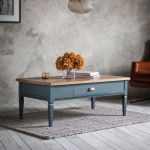 The Atlantic 1 drawer coffee table in blue grey with flowers and books on top
