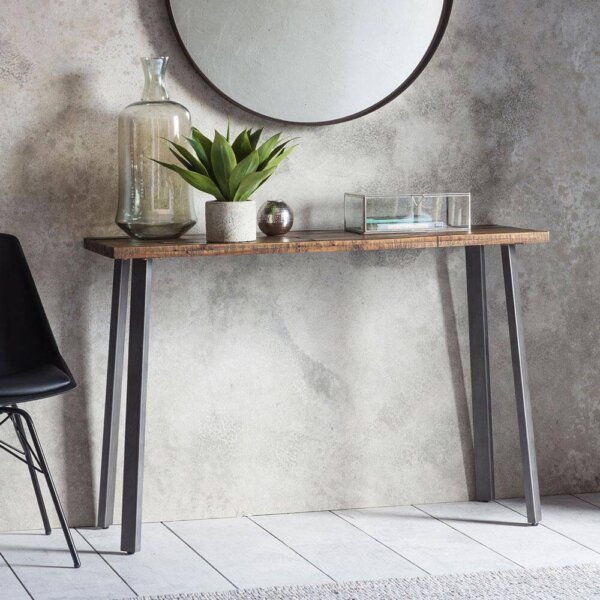 The Loft Console Table against the wall under a round mirror