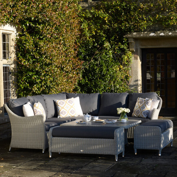 2021 Bramblecrest Monterey 8 Seater Outdoor Sofa Set in an ivy-covered courtyard