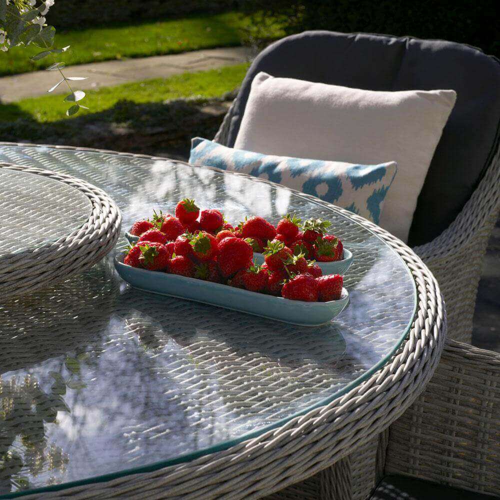 2 long, thin trays Of Strawberries on a 2021 Bramblecrest Monterey 6 Seat Garden Dining Table With Lazy Susan