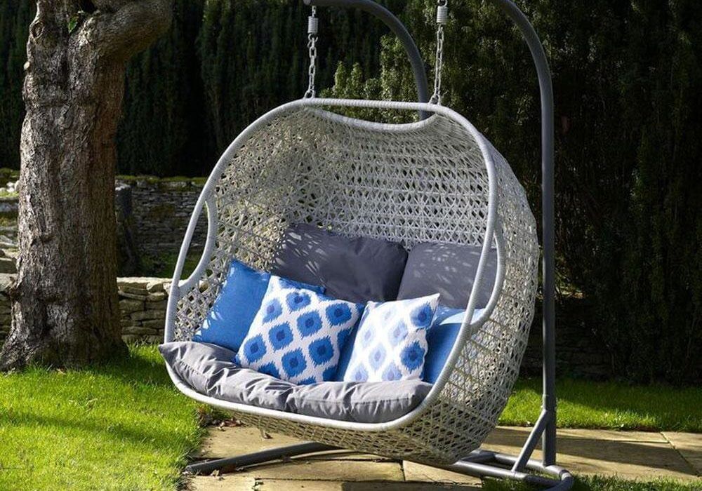 2021 Bramblecrest Monterey Double Hanging Cocoon Chair With Cushions In A Garden Setting