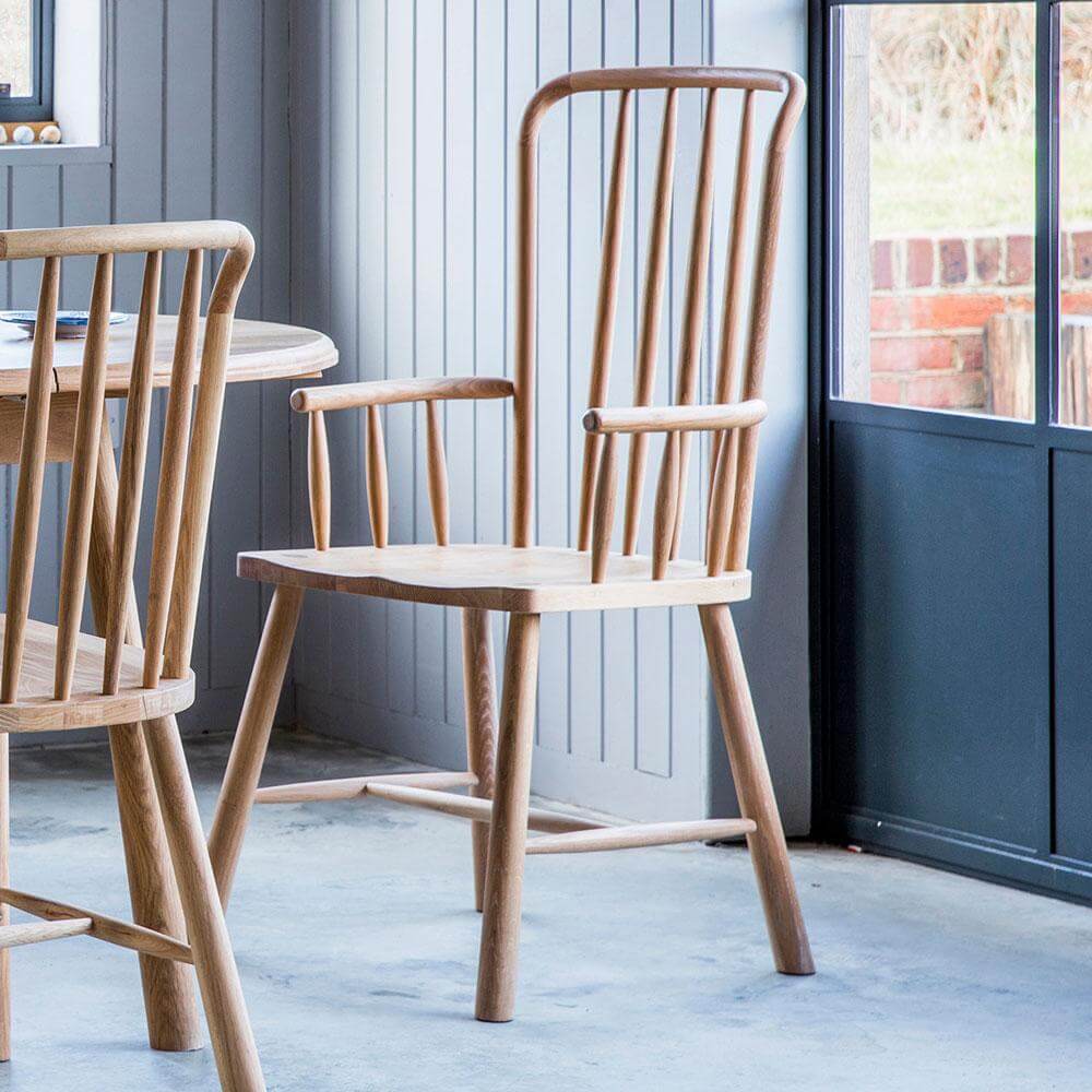 close up of Bergen arm chair placed around a dining table