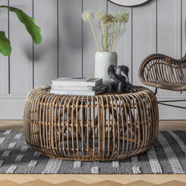 Rattan Coffee Table with vase, books and ornaments on top