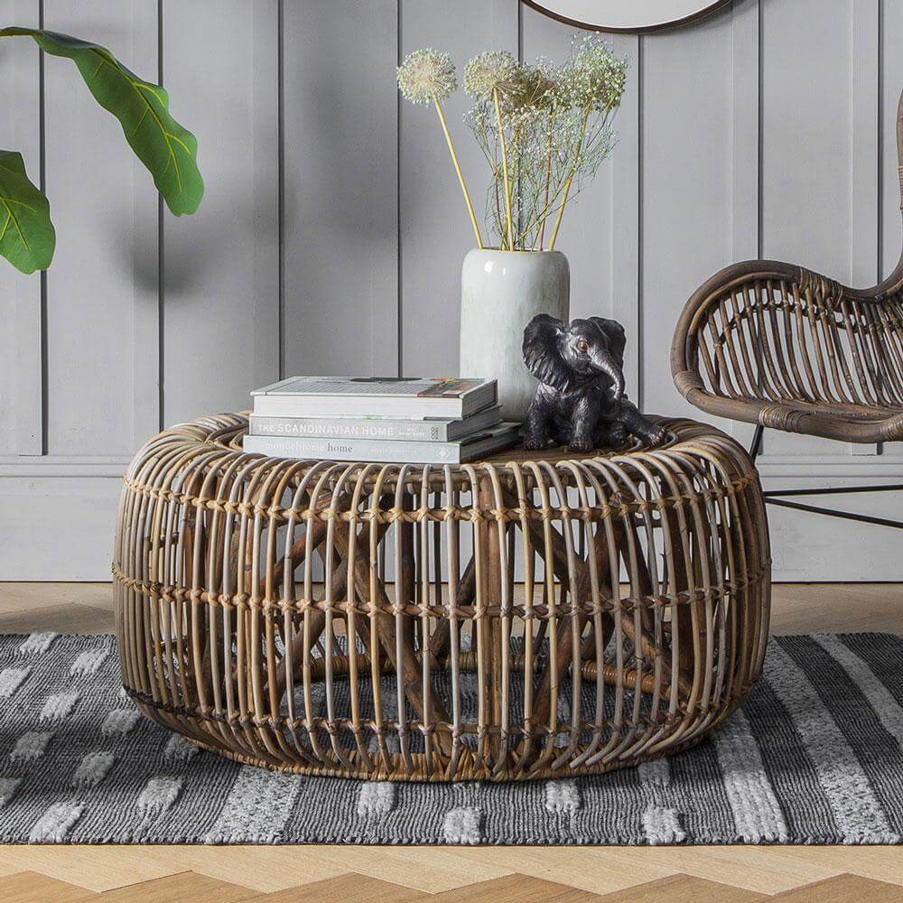 Rattan Coffee Table with vase, books and ornaments on top