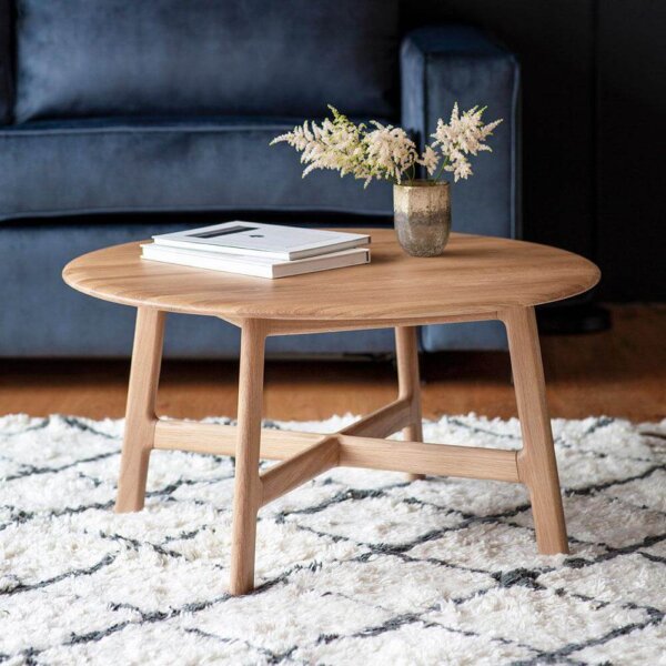 Barcelona Round Coffee Table with vase and books on top