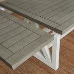 grey pine extension leaf partially inputted into pine dining table