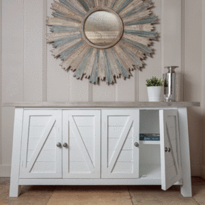 white and grey sideboard with right side cupboard door open - pictured under large circular gold mirror on wall