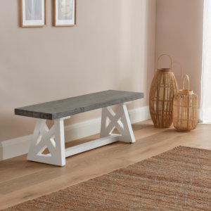 White and Grey small dining bench placed next to a wall on a wooden floor