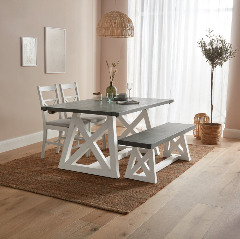 Angled white and grey wood extendable dining table set with matching bench and two dining chairs