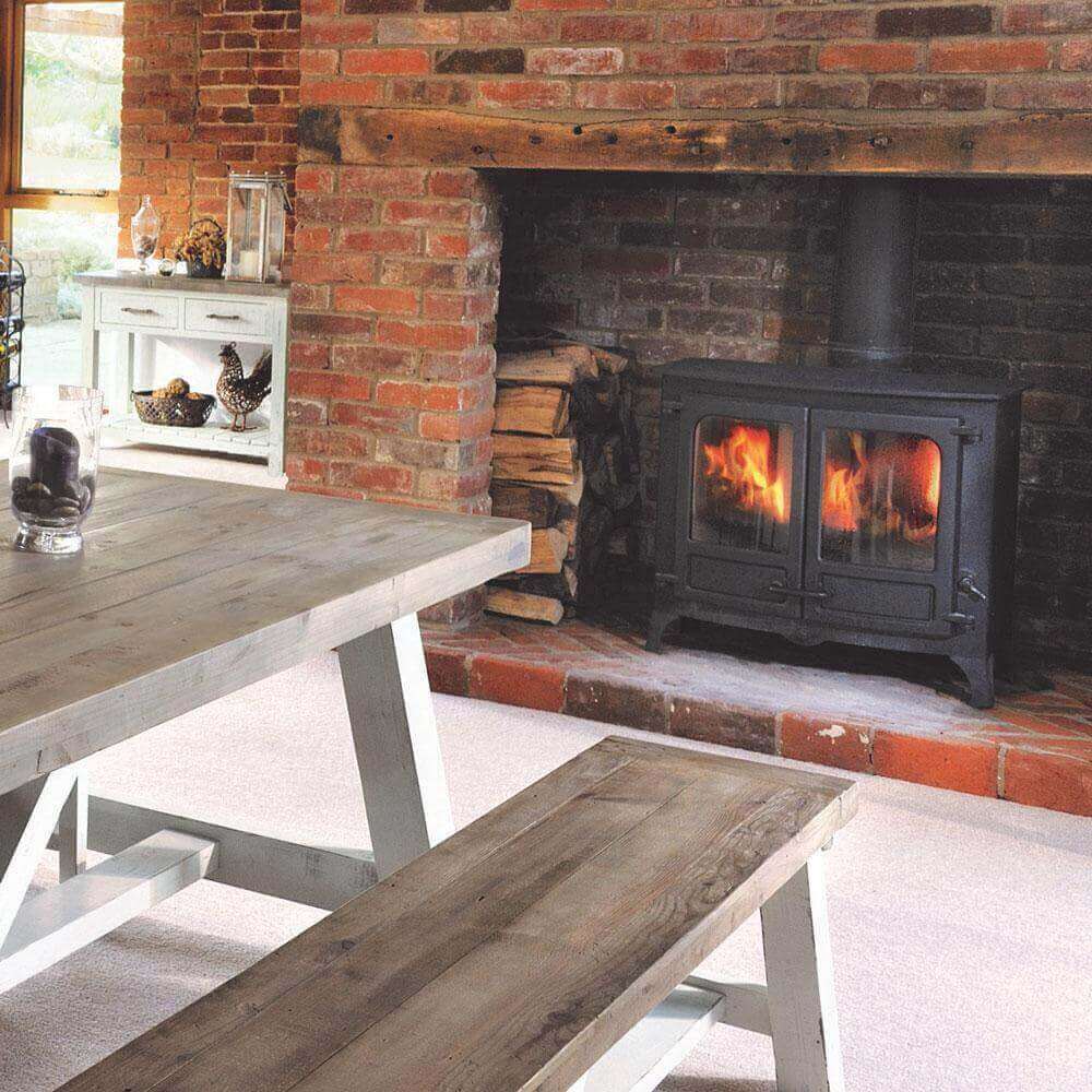 close up of Modern Farmhouse dining bench placed next to a fire in a rustic home