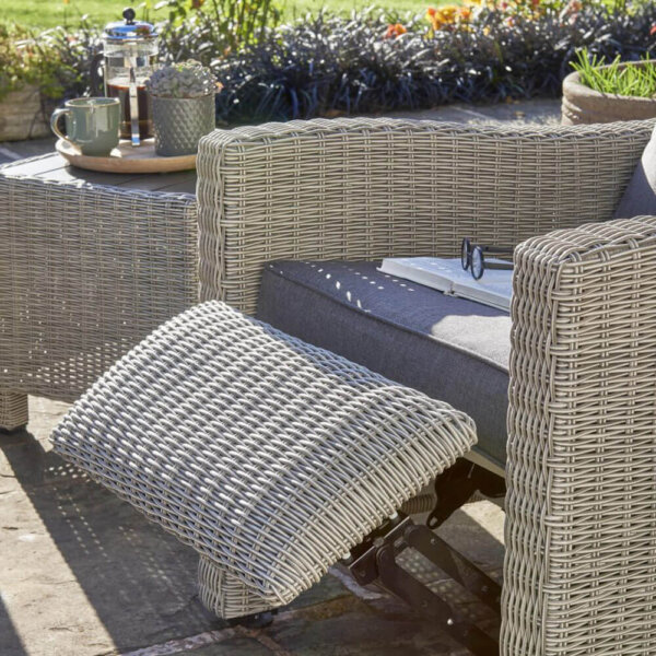 Close up of footrest for Palma duo relaxer outdoors with table