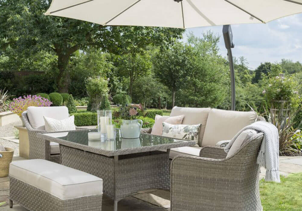 Kettler Charlbury casual 6 seat gaden sining sofa set in garden setting with hanging canopy