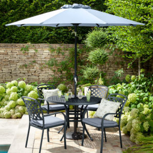 2020 hartman Berkeley 4 seat garden dining set with round table. on garden patio with parasol