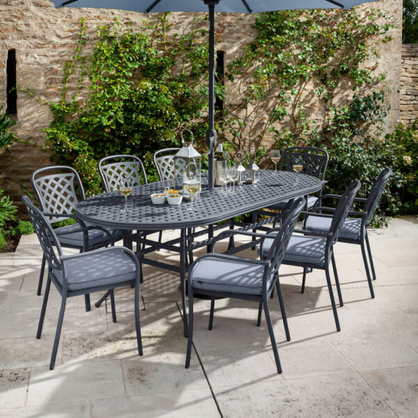 2020 Hartman berkeley 8 seat garden dining set with oval table- antique grey/ platinum. table with wine glasses on and parasol over table