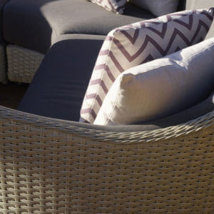 close up of chevron cocoa square scatter cushion on outdoor chair