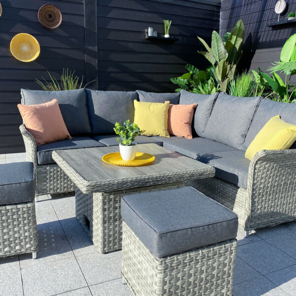 Grey_cushioned_corner_garden_sofa_with_square_ceramic_table_and_2_stools_in_courtyard