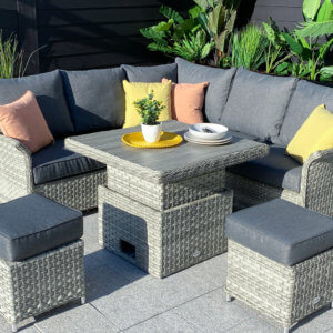 Square_garden_corner_set_with_height_adjustable_table_on_paving