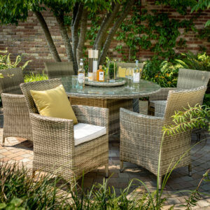 6_seat_rattan_Hartman_Westbury_garden_Dinin_set_with_parasol_in_courtyard