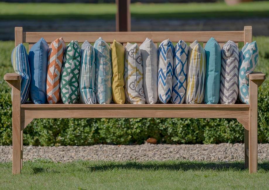 Bramblecrest outdoor cushions lined up on bench