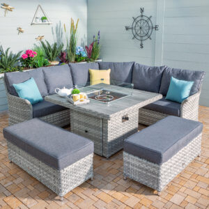 grey_square_shaped_garden_furniture_sofa_set_in_courtyard_with_weather_vane_in background