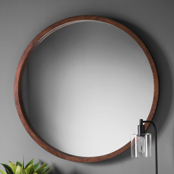 Chic-brown-round-mirror-on-grey-wall