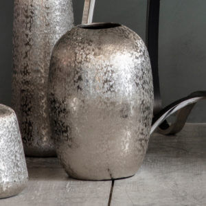 Bilbao Silver Eliptical Vase on grey wooden floor with other silver vases