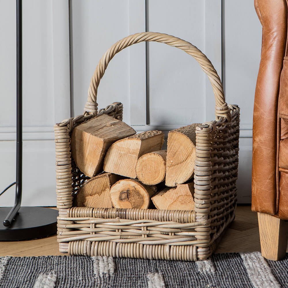 basket with split wood and handle sat on grey rug with wood board wall background