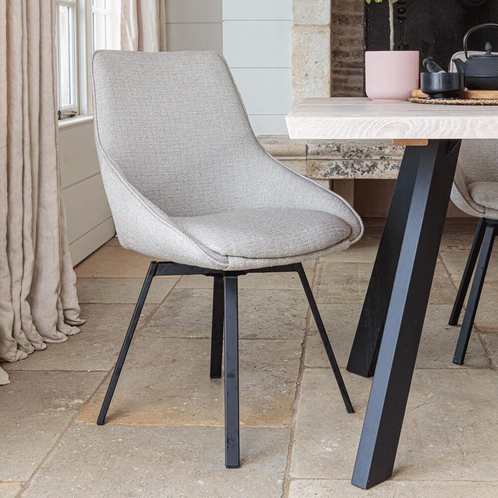 Close up of Gaudi dining chair in Light Grey on pale stone floor