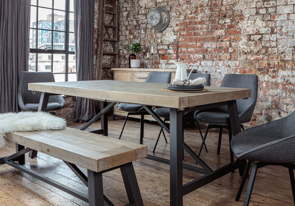 Urban dining table set with Gaudi dining chairs in an urban style room with exposed brick walls