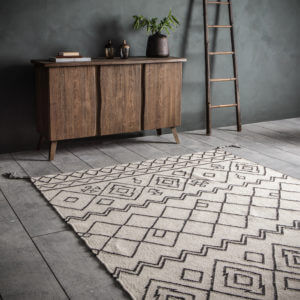 Stencil Tasseled Rug Black/Cream Indoors with cabinet and ladder