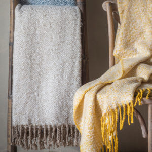 Twill Imitation Mohair Throw Taupe hanging over ladder with ochre throw on a chair