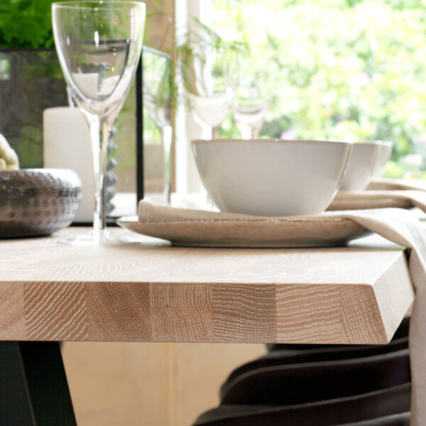 Valencia Light Oak Dining Table Side Profile with dinnerware up on top