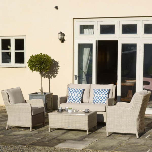 Sandy_coloured_garden_furniture_in_front_of_french_windows