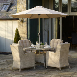 Round_table_Garden_Dining_Set_With_Parasol_On_Paving