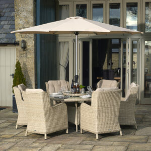 Round_table_garden_dining_Set_Pale_Woven_On_Paving