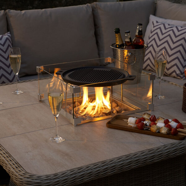 Fire_Pit_With_Metal_griddle_On_Garden_table