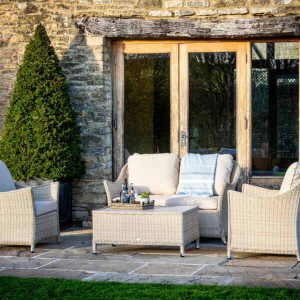 Garden_furniture_In_courtyard_Of_Country_Home_In_Front_Of_French_Windows