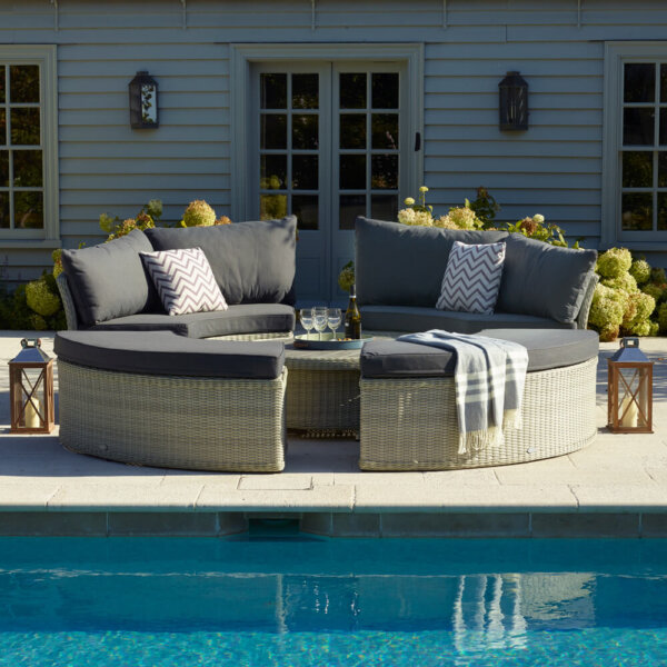 Grey_circular_Garden_furniture_Next_To_Swimming_Pool-With_Cushions_On