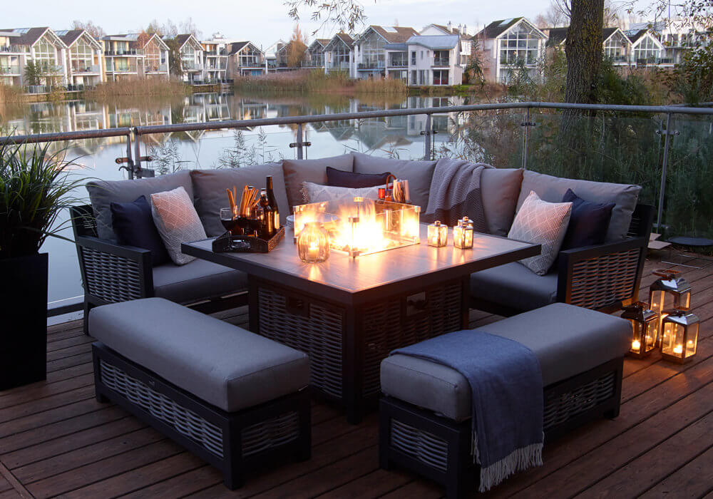 Fire_Pit_Garden_Dining_Set_In_Dusky+light_With_River_Background