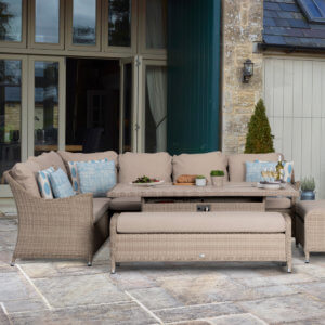 Bramblecrest Monterey Garden Sofa Set With Rectangle Fire Pit Dining Table & 2 Benches in situ