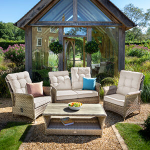 2_seat_sofa_and_2_seat_arm_chair_coffee_table_set_in_garden_setting_in_sunshine