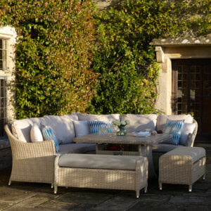 Shaded_garden_furniture_set_in_courtyard_ivy_wall_Background